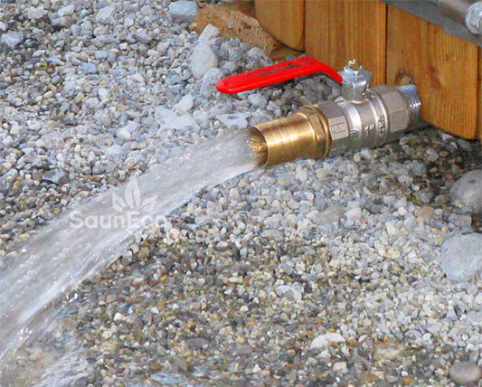Sauneco wooden hot tub drainage tap connected to hose